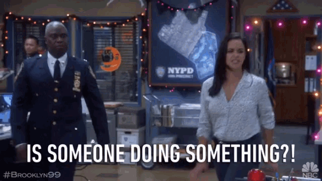 a man and a woman standing in front of a nypd poster