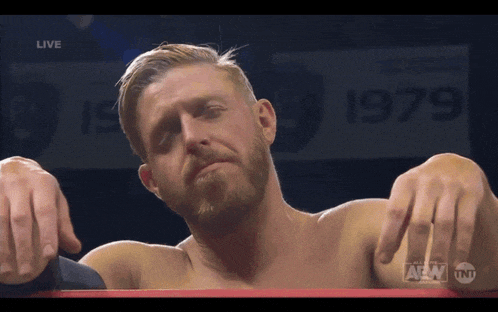 a man in a wrestling ring with a sign that says 1979 on it