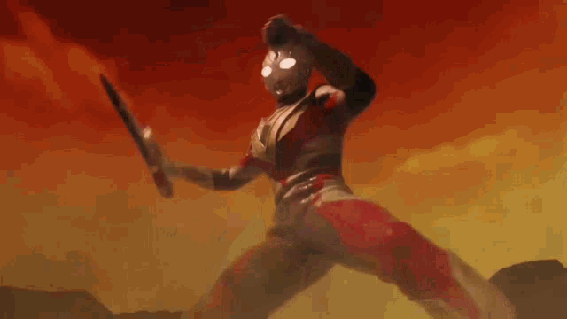 a cartoon character in a red and silver outfit is holding a bat