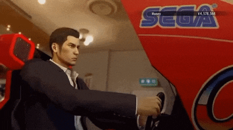 a man in a suit is playing a video game in front of a sign that says sega