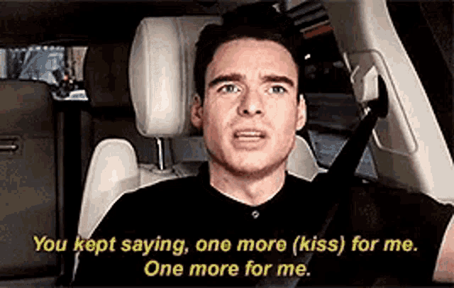 a man is sitting in the back seat of a car and saying `` you kept saying one more kiss for me .