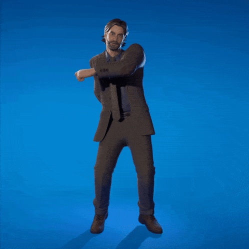 a man in a suit and tie is kneeling on a blue background