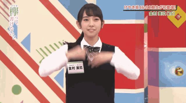 a girl wearing a name tag that says ' osu ' on it