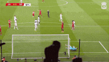 a soccer game is being played with the score at 4 to 0
