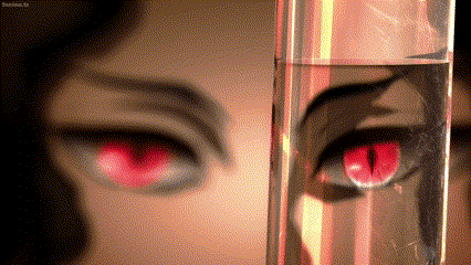 a close up of a person 's eyes with red eyes and a glass of water .