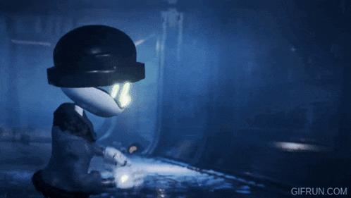 a person is holding a sword in a dark room .