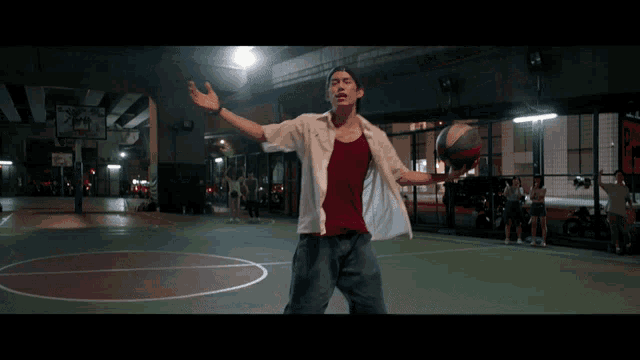 a man playing basketball on a court with a sign that says ' basketball court ' on it