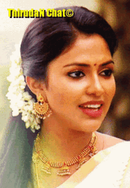 a close up of a woman 's face with a caption that says ' thiruda chat '