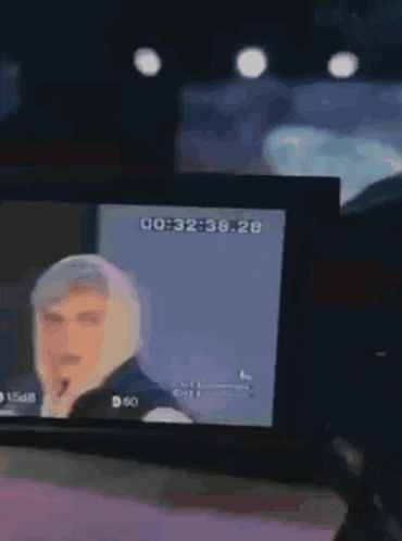 a man is being recorded on a video camera with a time of 00:33:28