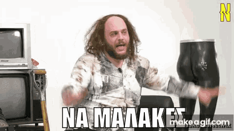 a man with long hair and a beard is holding a mannequin 's butt and says na maaakes
