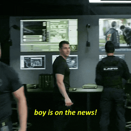 a police officer says boy is on the news while standing next to another officer