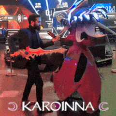 a man in a suit is holding a sword in front of a giant monster with the name karoinna c