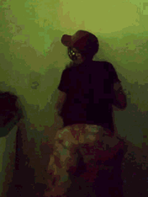 a blurry picture of a person wearing a baseball cap