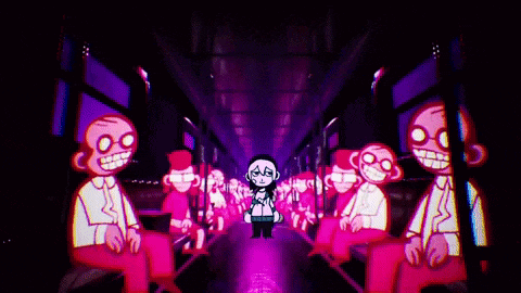 a group of people are sitting on a bus in a dark tunnel .