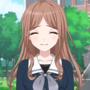 a girl with long brown hair is smiling with her eyes closed in front of a brick building
