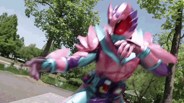 a pink and purple superhero is standing in front of a lake .