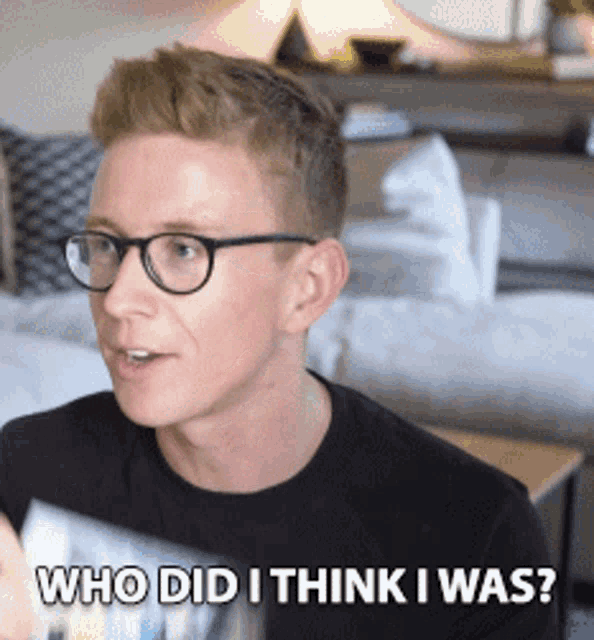 a man wearing glasses and a black shirt is asking who did i think i was