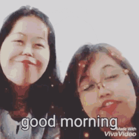 two girls are making funny faces and the words good morning are on the screen