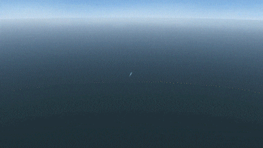an aerial view of a large body of water with a small boat in the distance