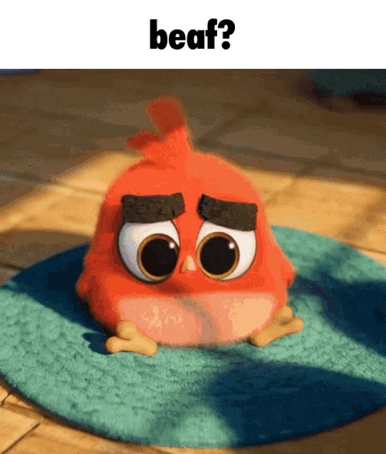 a red angry bird with big eyes sits on a blue mat with the words beaf behind it