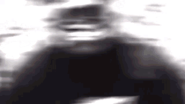 a close up of a person 's face in a blurry photo .