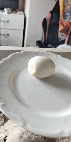 a hard boiled egg on a white plate