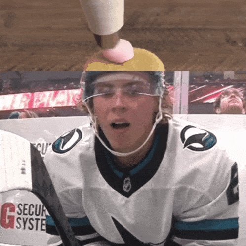 a hockey player wearing a jersey that says " secur system " on it