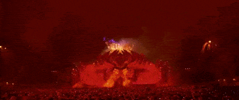 a crowd of people watching fireworks at a concert .