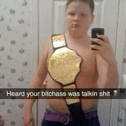a shirtless man is taking a selfie with a wrestling championship belt around his neck .