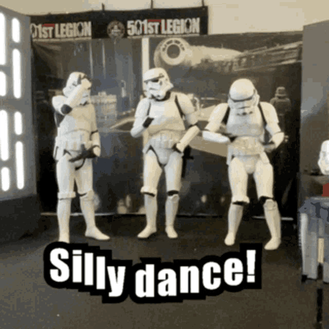 stormtroopers dancing in front of a 501st legion banner