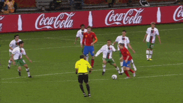 a soccer player wearing number 11 kicks the ball