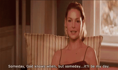 a woman is sitting in a chair with the words someday god knows when but someday it 'll be my day