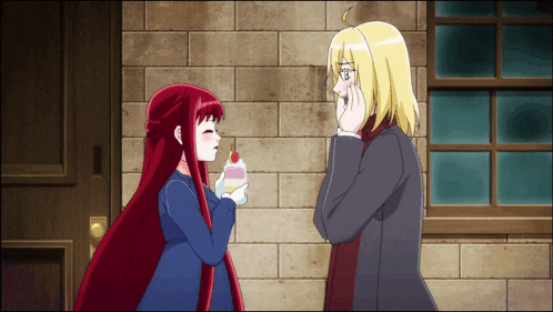 a man and a girl are standing next to each other and the girl is holding a cherry