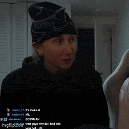 a man wearing a beanie is smiling in front of a screen that says imgflip.com in the corner