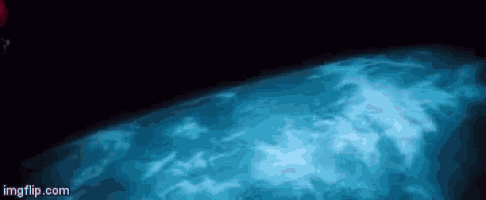 a person is swimming in a pool with a blue light coming out of the water .