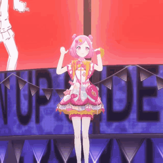 a girl in a pink dress is standing in front of a sign that says up de