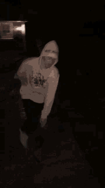 a blurry picture of a person holding another person 's arm .