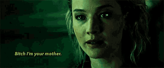 a close up of a woman 's face with the words `` bitch i 'm your mother '' written above her .