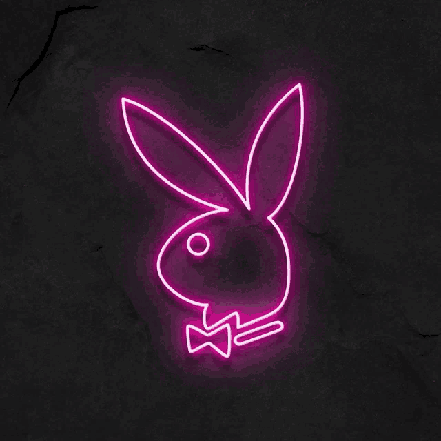 a pink neon sign of a playboy bunny with a bow tie
