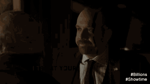 a man in a suit and tie says " i trust your judgment " in a dark room