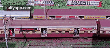 an aerial view of a train station with a sign that says agsacem .