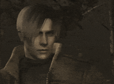 a close up of a person 's face with their hands on their head
