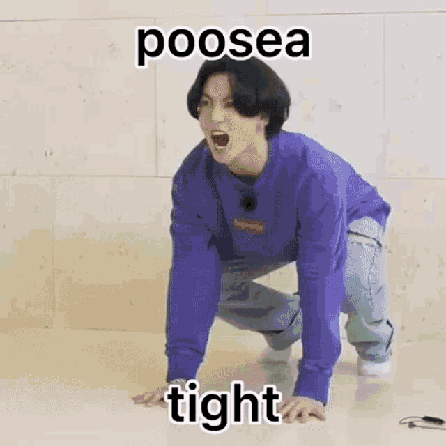 a man in a purple sweatshirt is kneeling on the floor with his mouth open and a meme .