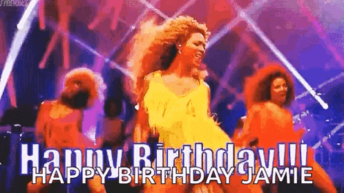 a woman in a yellow dress is dancing on a stage in front of a group of people .