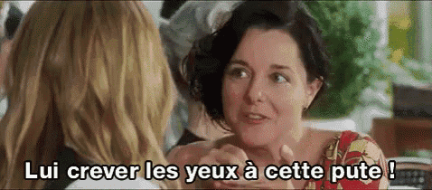 a woman is talking to another woman in a foreign language while holding her hands .