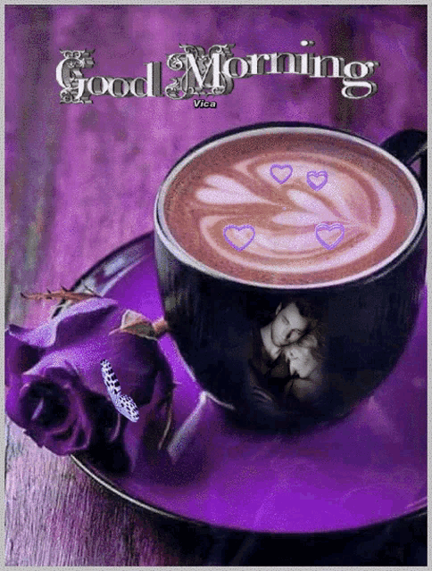a cup of coffee on a purple saucer with the words good morning written on it