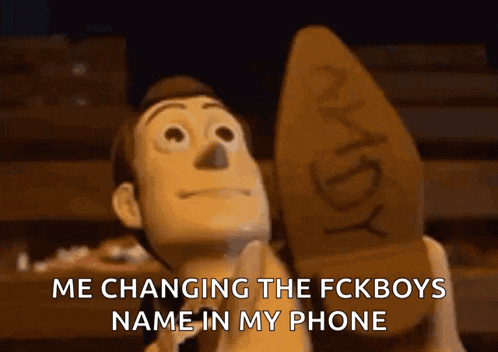 a toy story character is holding a shoe with the word andy on it