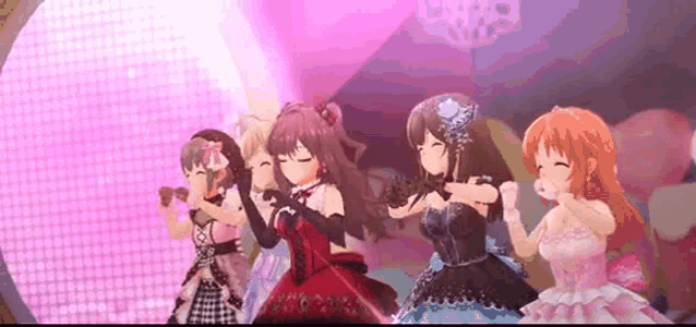a group of anime girls are dancing on a stage .