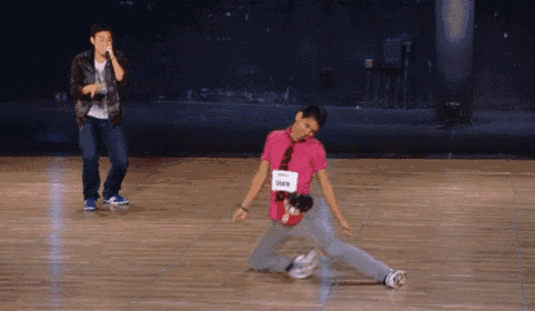 a person with a name tag that says 3450 is dancing on the floor