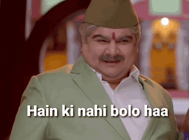 a man in a green suit and hat with the words hain ki nahi bolo haa on the bottom